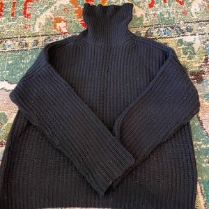 Black cashmere ribbed turtleneck.